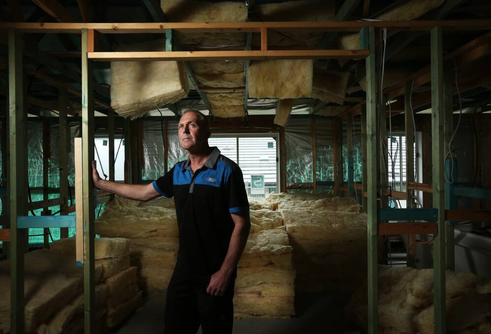 Mick Smith at his partially-built Privium home at Raymond Terrace. Picture: Marina Neil