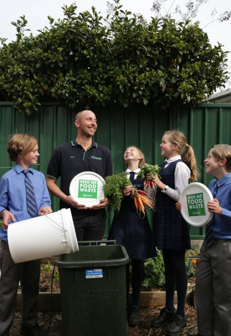SUSTAINABILITY: David Sivyer, pictured here with students of Thereses Primary School New Lambton, is transforming the farm-to-plate sustainable agriculture.