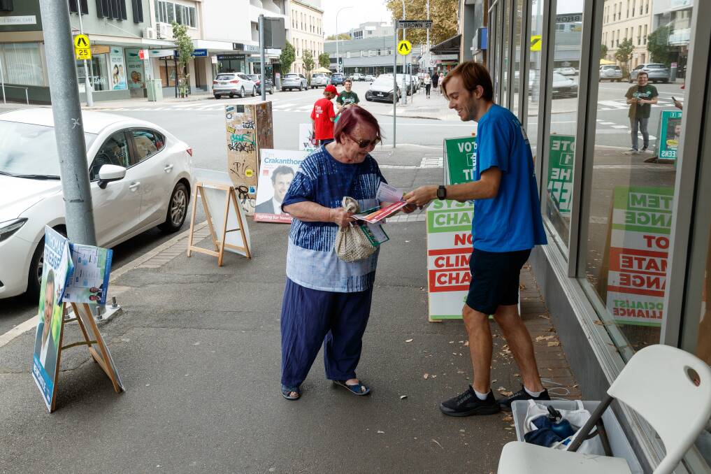 Early voters on King Street in Newcastle Tuesday identified addressing climate change as a key issue for the new state government come this weekend's state election result. Picture by Max Mason-Hubers