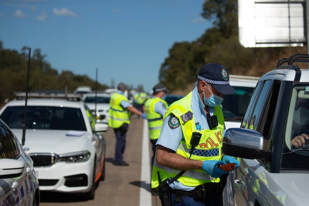 Checkpoint: Police stopping drivers on the M1 Pacific Motorway at Morisset in August, 2021. Picture: Marina Neil