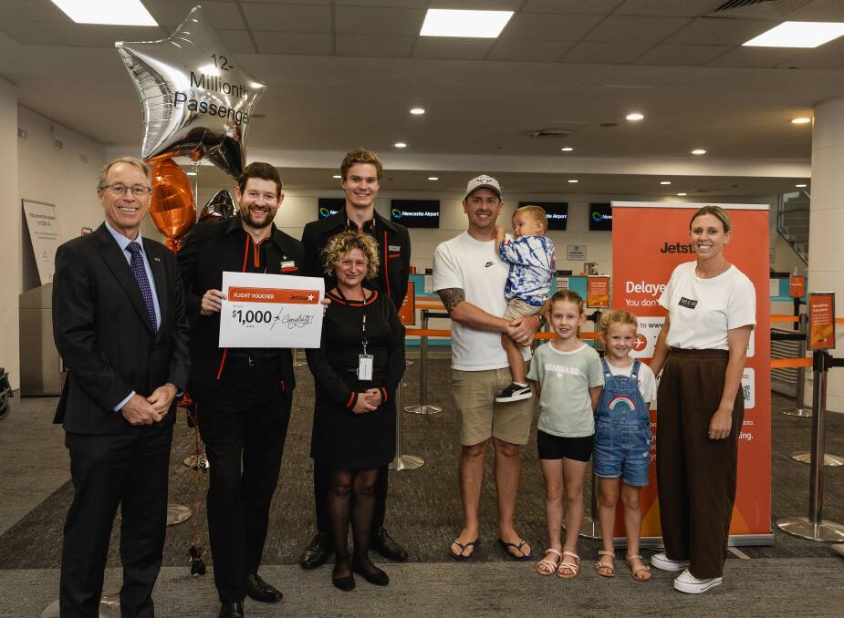 Jetstar's 12 millionth passengers Jay Marlin and his wife, Abbie, with daughters Ava, 7 and Lyla, 5, and son Beau, 2. Picture by Marina Neil