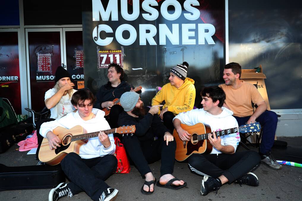 Not to be beaten, Taylan Bragg, Sam Rush, Sam Spencer and Pat Reilly at the back, and Banjo Longworth, Nathan Field and Dominic Matthews at the front, jam out a tune ahead of this year's May 4 Musos Corner sale. Pictures by Peter Lorimer