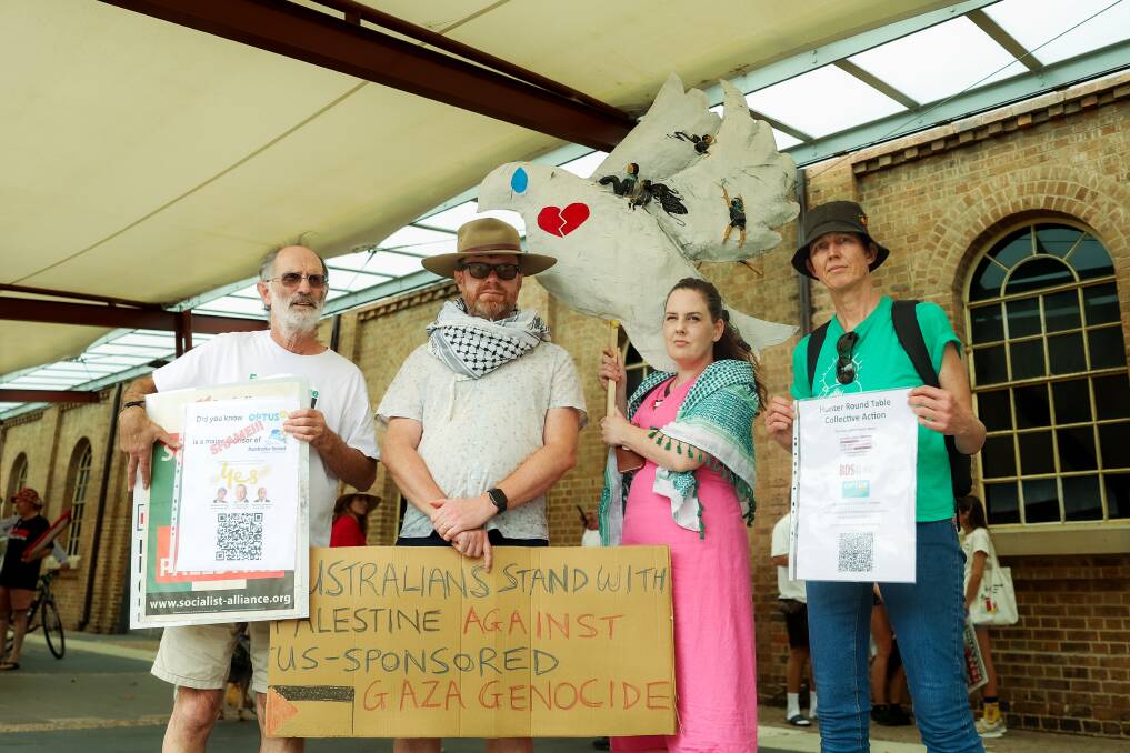 Megan Clarke (centre) with protestors Niko Leka, Richard Bean and Kerrie McGrath before the demonstration was staged on Saturday. Ms Clarke has called for the federal government to do more to affect a ceasefire in the Middle East. Picture by Simon McCarthy
