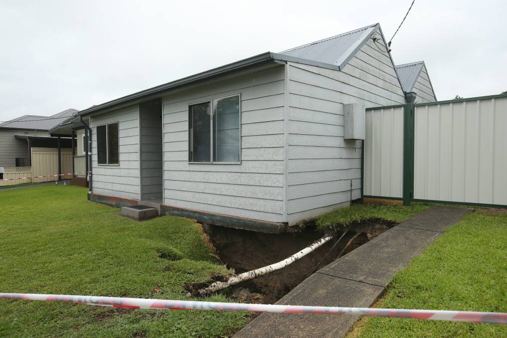 A second sinkhole opened at a home on Platt Street Monday, undermining part of the building and driveway, exposing underground pipes. Neighbouring resident Jackson Bennett said he heard a loud noise in the night but was unaware of the sink hole until the morning. Picture by Simone De Peak