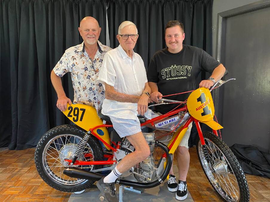 Keith Davies, a legend of Australian racing, with his son Steve and grandson Alex and his restored slider motorcycle. Picture by Peter Lorimer
