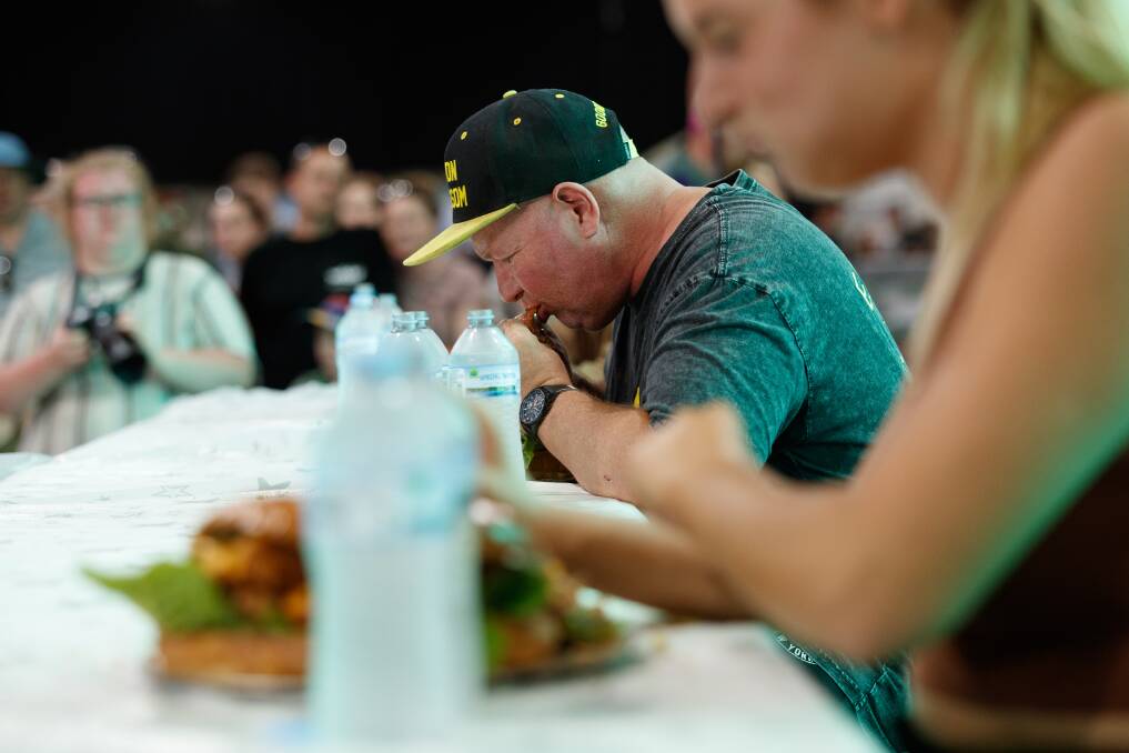 Lemon Blossom amazed the crowd smashing his own record, finishing the massive Harbour Bar burger in under half an hour. Picture: Max Mason-Hubers