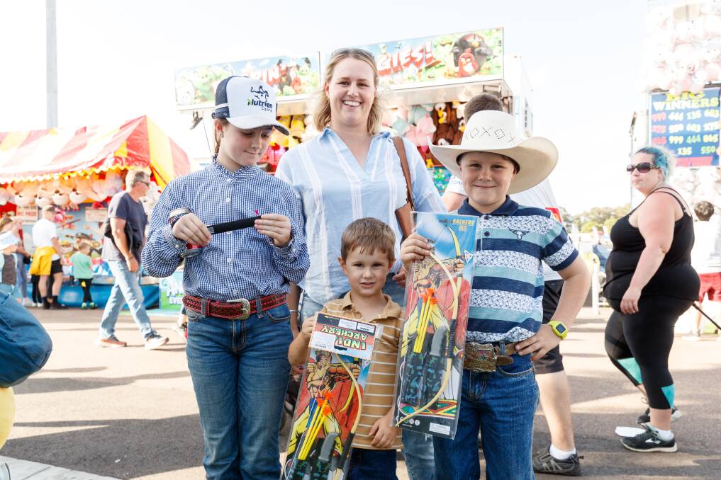 Jess Turner of Dungog with her children - Ella, Daley and Seb - at the Newcastle Show on Saturday. Picture: Max Mason-Hubers