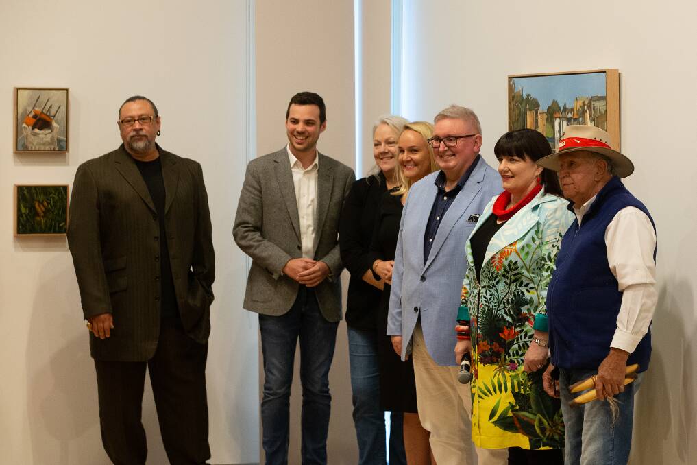 Arts Minister Don Harwin (pictured here third-from-right) with (from left) WARWAR exhibition curator Brian Robinson, deputy lord mayor Declan Clausen, City of Newcastle councillor Carol Duncan, Lord Mayor Nuatali Nelmes, Gallery director Lauretta Morton and Uncle Bill Smith at the opening of the WARWAR exhibition on Saturday. Picture: Marina Neil