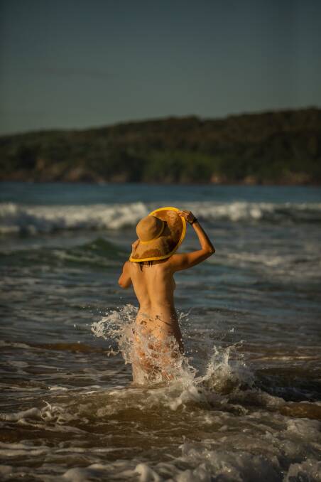 8: A naturist wades into the waves at Samurai Beach, Port Stephens, NSW. Picture: Marina Neil