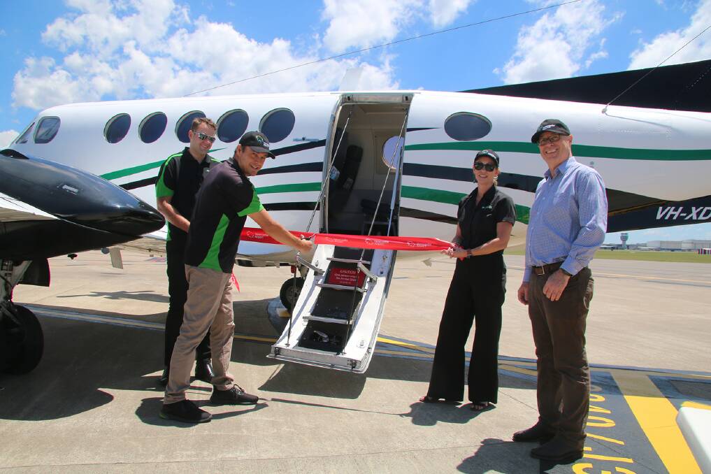 Representatives of Newcastle Airport and Eastern Air Services symbolically cut the ribbon on the first direct flight to Lord Howe from Newcastle on Saturday.