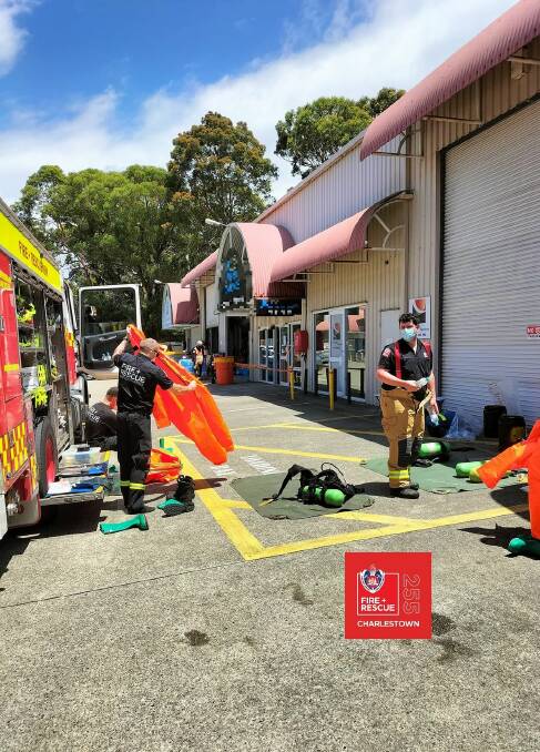 Firefighters on the scene of a suspected chlorine spill at Warners Bay Thursday. Picture: NSW Fire and Rescue