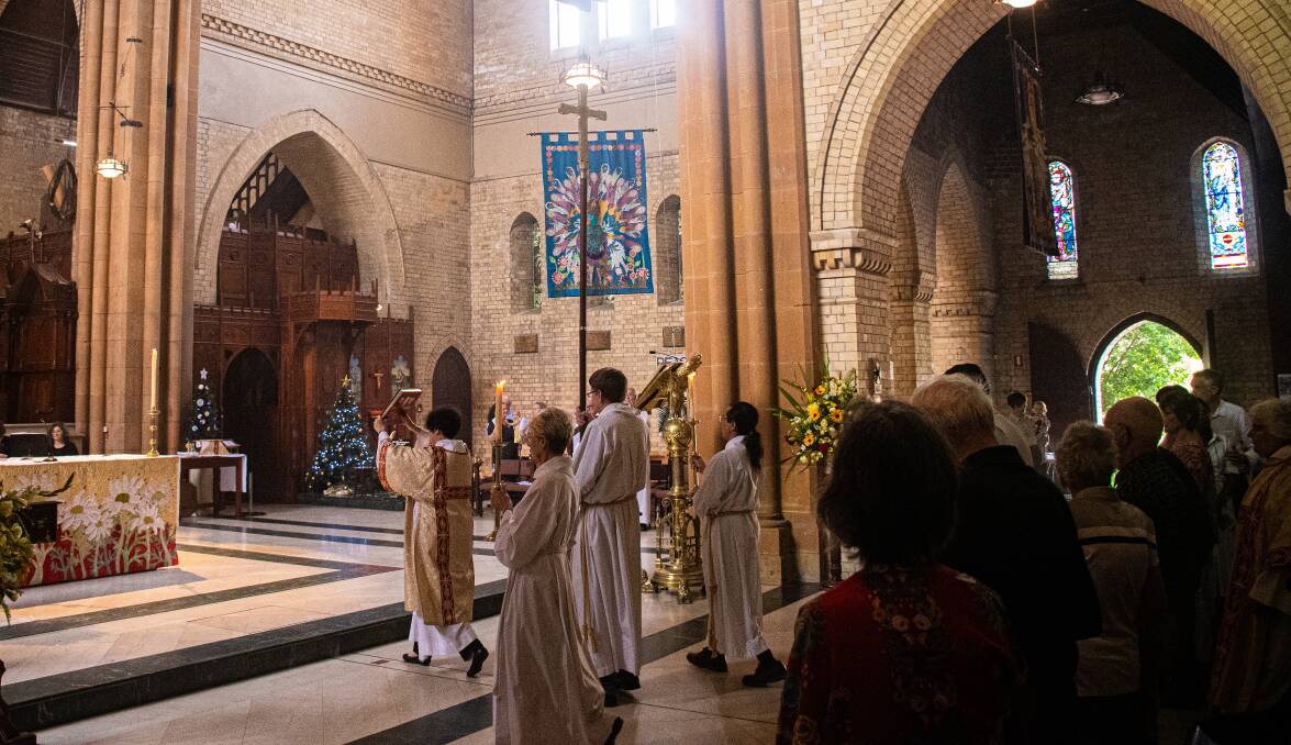 CEREMONY: Church leaders read from gospels at Christ Church Cathedral.