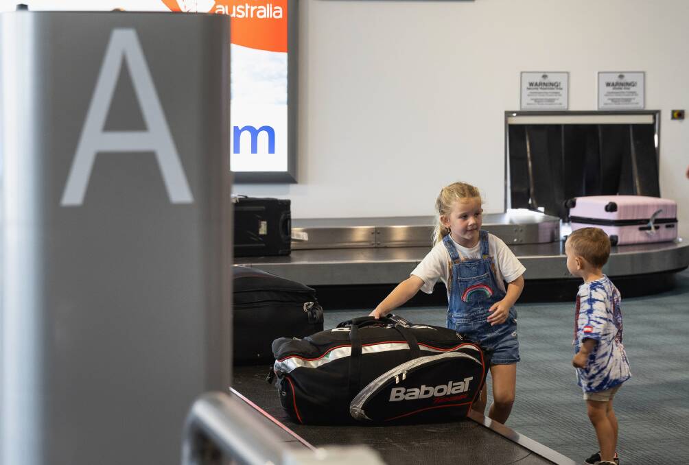 Jetstar's 12 millionth passengers Jay Marlin and his wife, Abbie, with daughters Ava, 7 and Lyla, 5, and son Beau, 2. Picture by Marina Neil