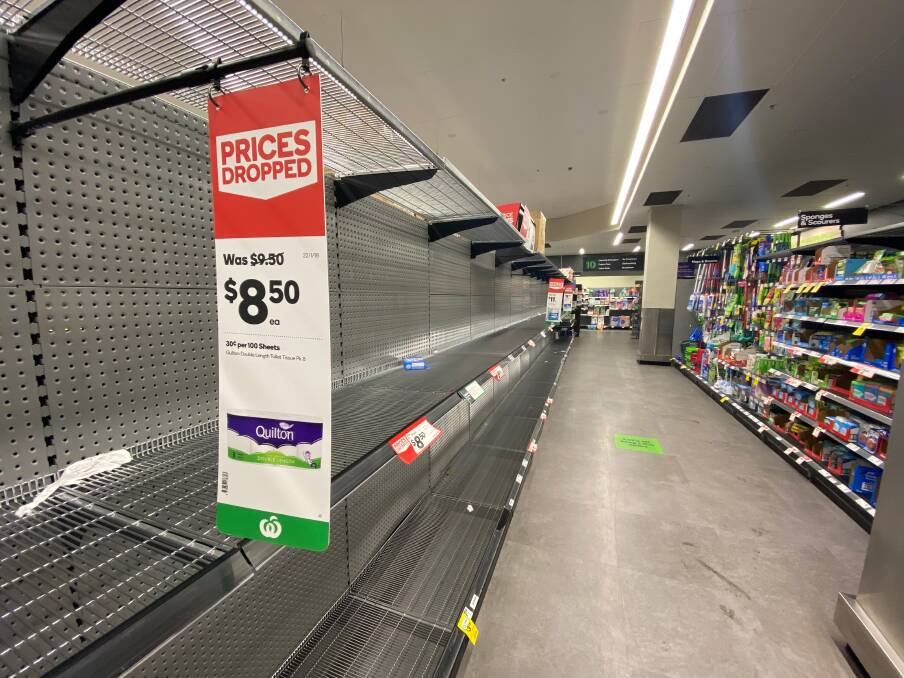 Shelves emptied at Woolworths Kotara on Sunday night, after public health order restrictions were announced by Premier Gladys Berejiklian on Saturday.