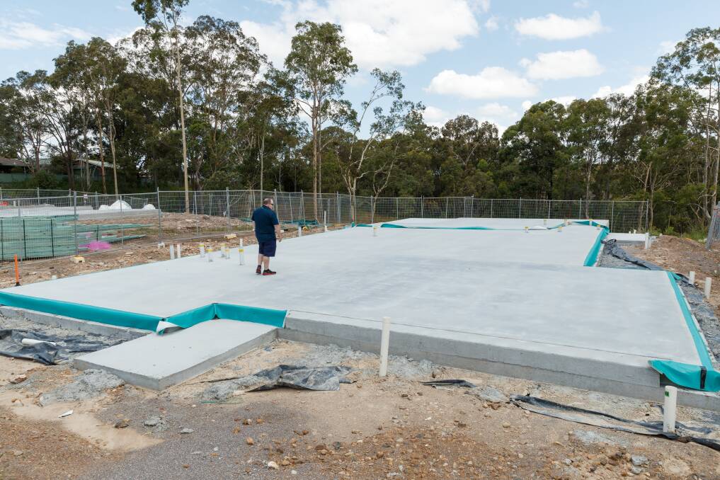 Nathan Whyte-Southcomb has also been impacted by the collapse of Privium Homes, which were building his house in the Heritage Parc development in Rutherford. Pictured with the concrete slab where his house was to be built. Picture: Marina Neil