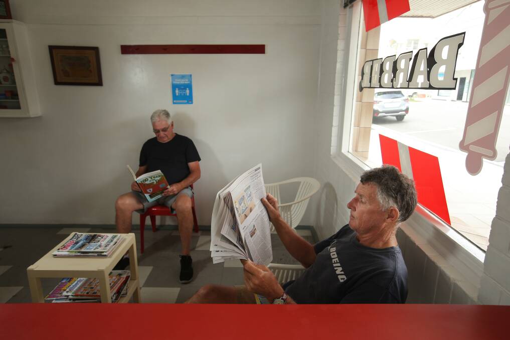 Bookings at Danny Everingham's barber shop are nominal. You come in, have a seat, and wait you turn. There is no hurry, Ron Hancock (left) says. Picture by Simone De Peak