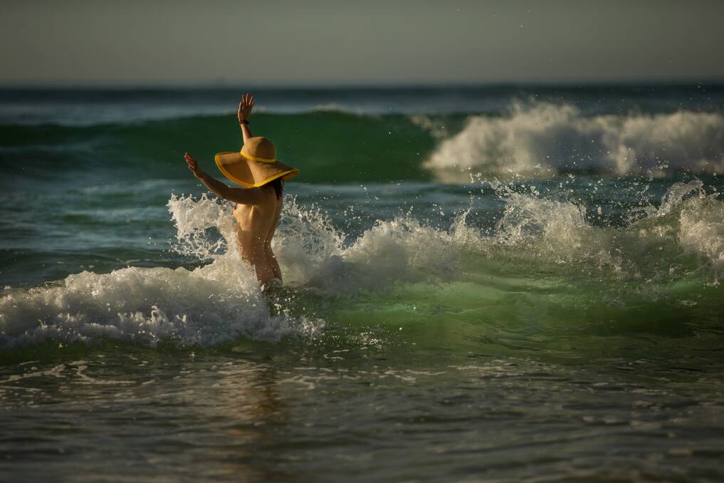 Feeling of freedom: A naturist wades into the waves at Samurai Beach, Port Stephens, NSW. Picture: Marina Neil