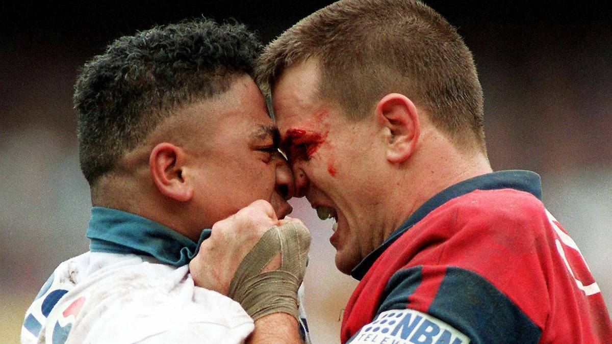 OLD SCHOOL: Manly's John Hopoate and Knights chief Paul Harragon express a difference of opinion in a 1995 Manly-Newcastle semi-final. (Photo: Craig Golding)