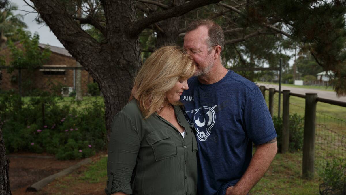 Kim and Gavin Smith in Fullerton Cove the day they found out the class action had been settled. Picture: Max Mason-Hubers