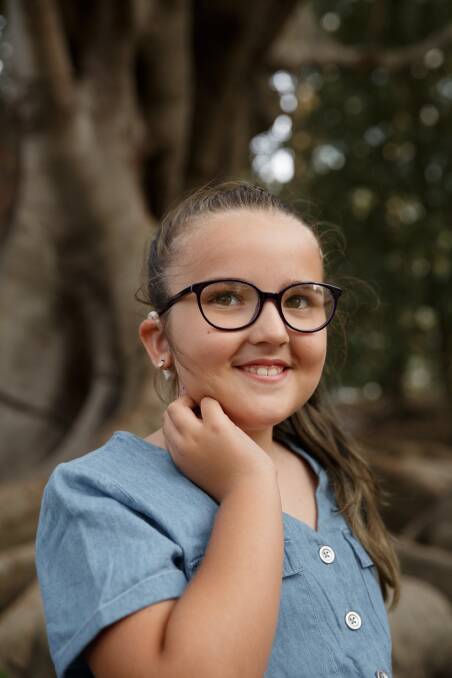 Abbi Keating, at age eight, has further reduced hearing. Photo: Max Mason-Hubers, the Newcastle Herald