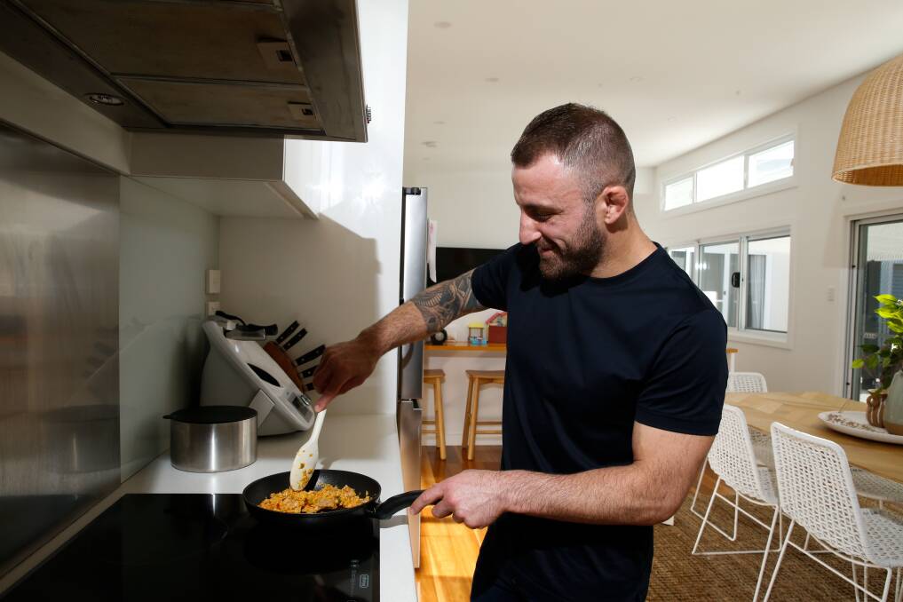 AT HOME: Alex Volkanovski, pictured at home in Windang, says cooking is an activity you can enjoy during lockdown. Pictures: Anna Warr 