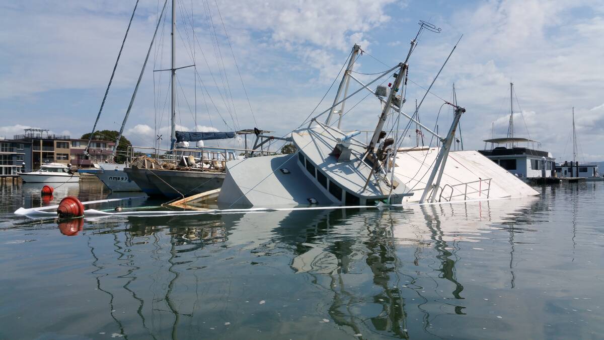 UNDERWATER: A 65-foot vessel moored at Lemon Tree Passage marina began sinking and spilling diesel in the water on Monday morning. Daniel McDonough, passing by in a kayak about 11.30am, snapped this photo before emergency crews arrived. Picture: Daniel McDonough