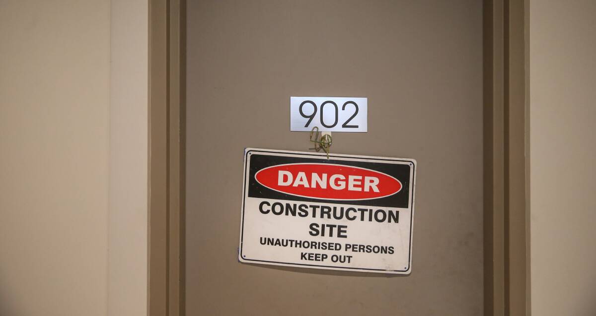 Warning: A sign on the door of a ninth floor apartment at the Landmark building in Charlestown. 