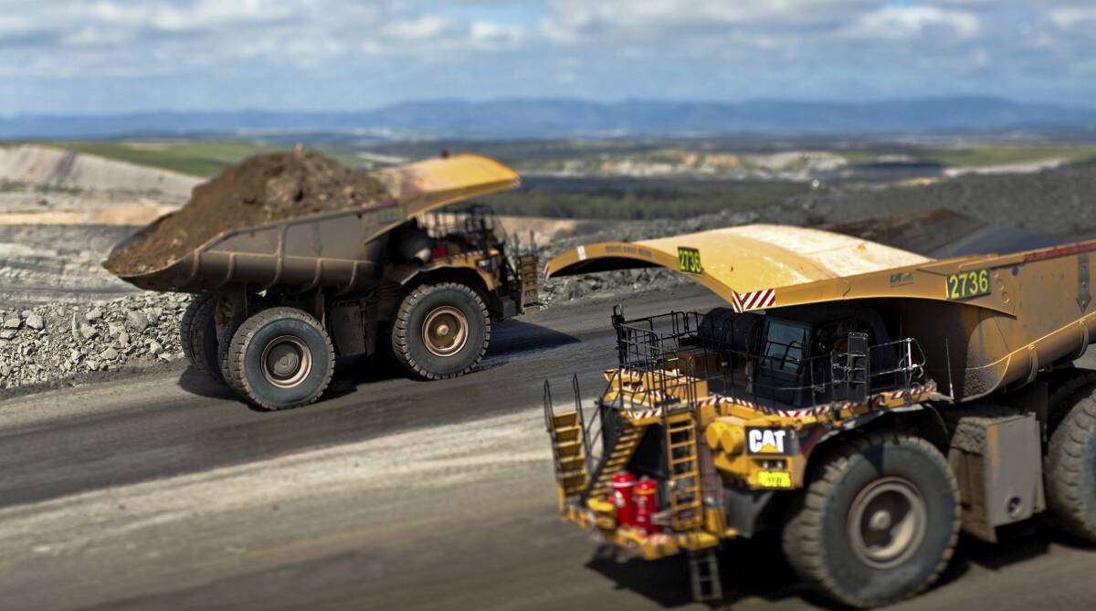 Expansion: Trucks at Glendell coal mine between Singleton and Muswellbrook, which is part of the Mount Owen mining complex. Glendell owner Glencore plans to more than double annual production from the mine and gain approval to remove 135 million tonnes until 2044.