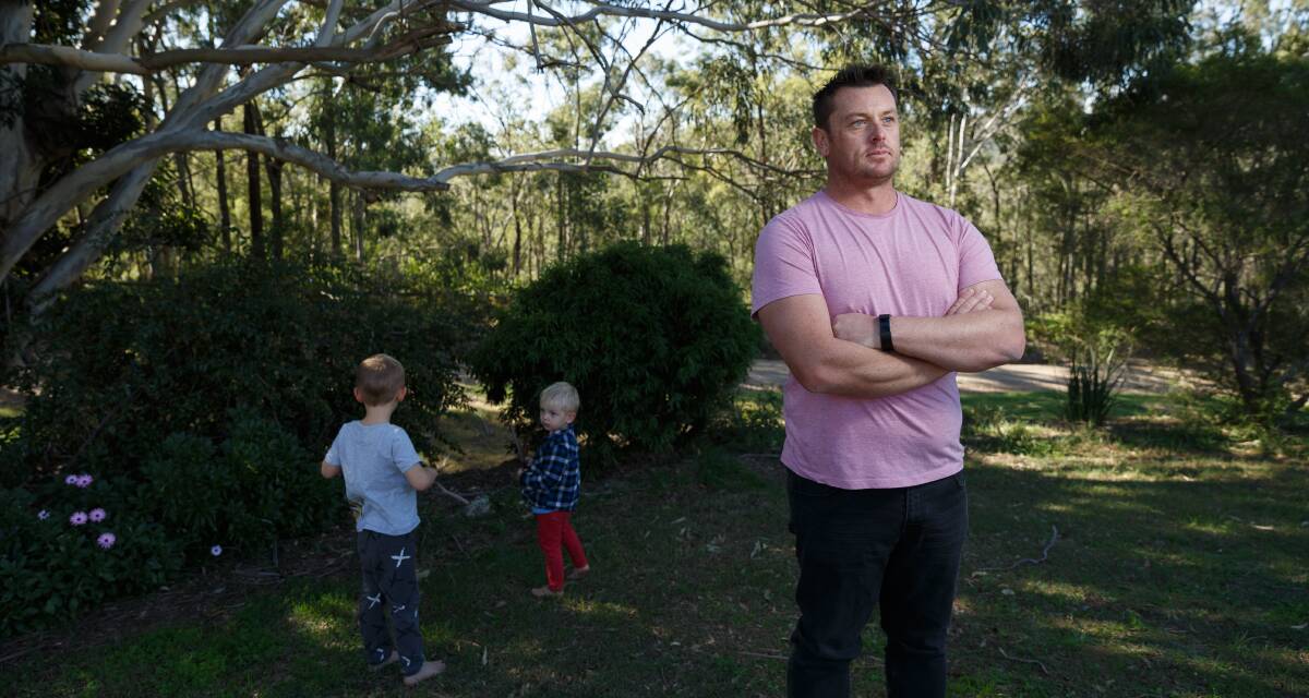 Objections: Brandy Hill resident Luke Redman and sons Lars, 2, and Torin, 4. Mr Redman and wife Chantal are strongly opposed to Hanson's plans to significantly increase operations at its Brandy Hill Quarry. Picture: Max Mason-Hubers.