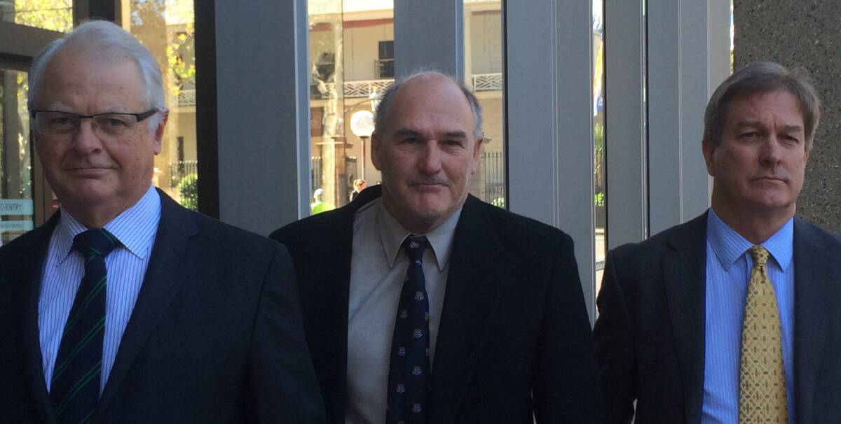 Determined: Developer David Vitnell (centre) leaves the NSW Supreme Court on Monday with barristers Christopher Barry, QC (left) and Greg Drew after a judge strongly criticised Port Stephens Council. 