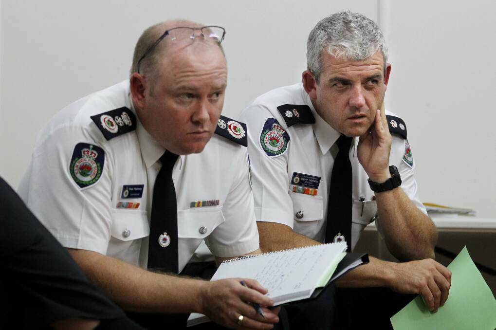 Concerns: NSW Rural Fire Service Commissioner Shane Fitzsimmons and Hunter RFS manager Jayson McKellar. Escaped fires pose a "very real and potentially deadly threat to the public', said Mr Fitzsimmons. Picture: Simone De Peak. 