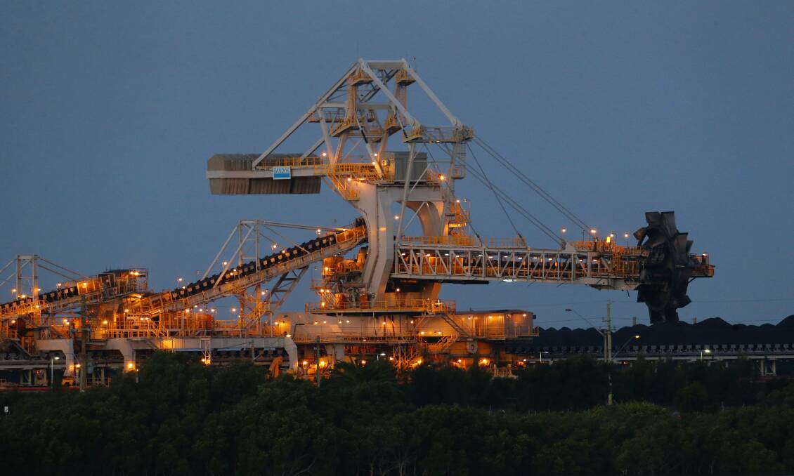 Future: Coal loading for export at Kooragang Island as mining infrastructure rises above the Hunter River. Picture: Max Mason-Hubers.