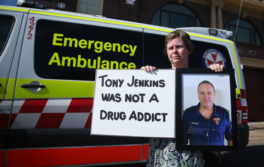 Protest: Sharon Jenkins stands outside Hamilton ambulance station on Tuesday to protest for an apology after NSW Ambulance inferred her late husband Tony had a drug addiction. Picture: Marina Neil.