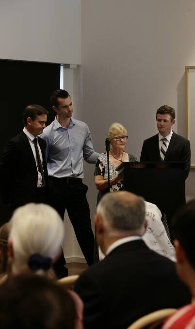 Honour: Libby Dingle and sons Christopher, Robert and Nicholas at a standing room only memorial service at Medowie today to honour the memory of their husband and father, Geoff Dingle. Picture: Simone De Peak. 