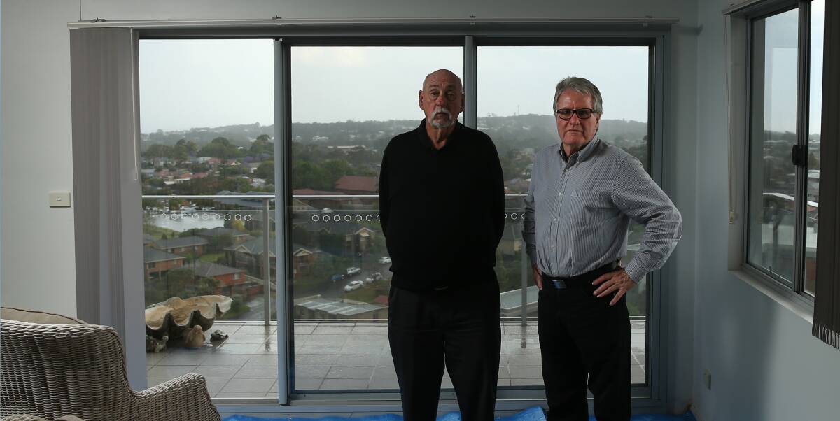 Angry: Richard Devon (left) and Aidan Ellis bought units on different levels of the Landmark building at Charlestown, where serious building defects have cost owners tens of thousands of dollars and caused significant distress. 