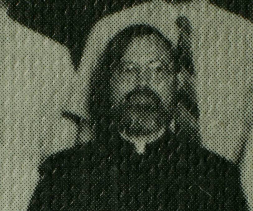 Notorious: Former Hunter Catholic priest and teacher John Denham in a St Pius X, Adamstown school photo from the 1970s. A jailed Denham, 76, has returned to wearing long hair, a moustache and thick beard, although it is now grey and white. 