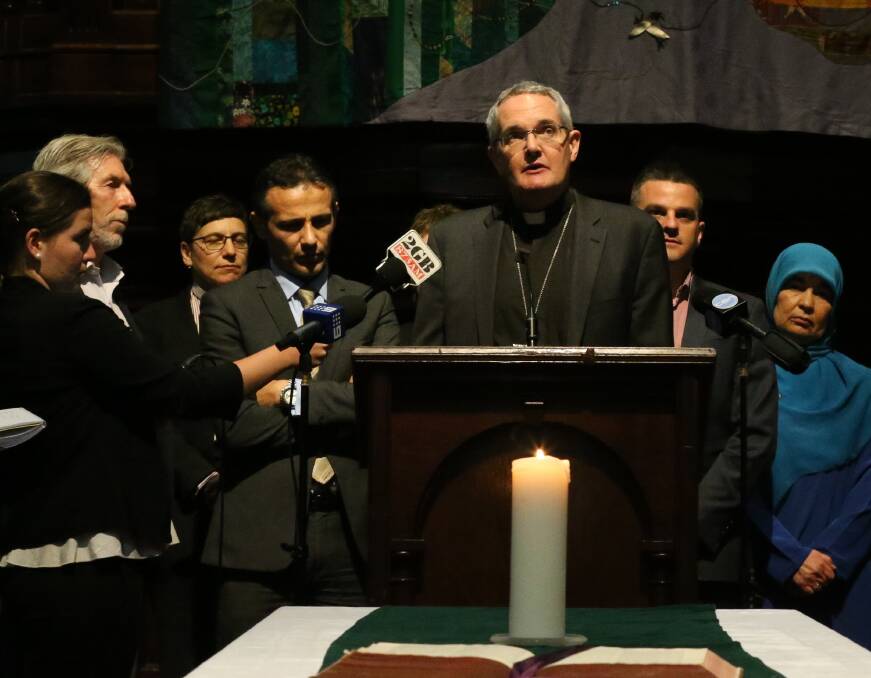 Moral: Former Uniting Church in Australia president Reverend Andrew Dutney during a multi-faith event. The church has ruled out selling its land at Hunter Economic Zone to accommodate a twin coal-fired power station proposal raised, and broadly criticised, last week. 