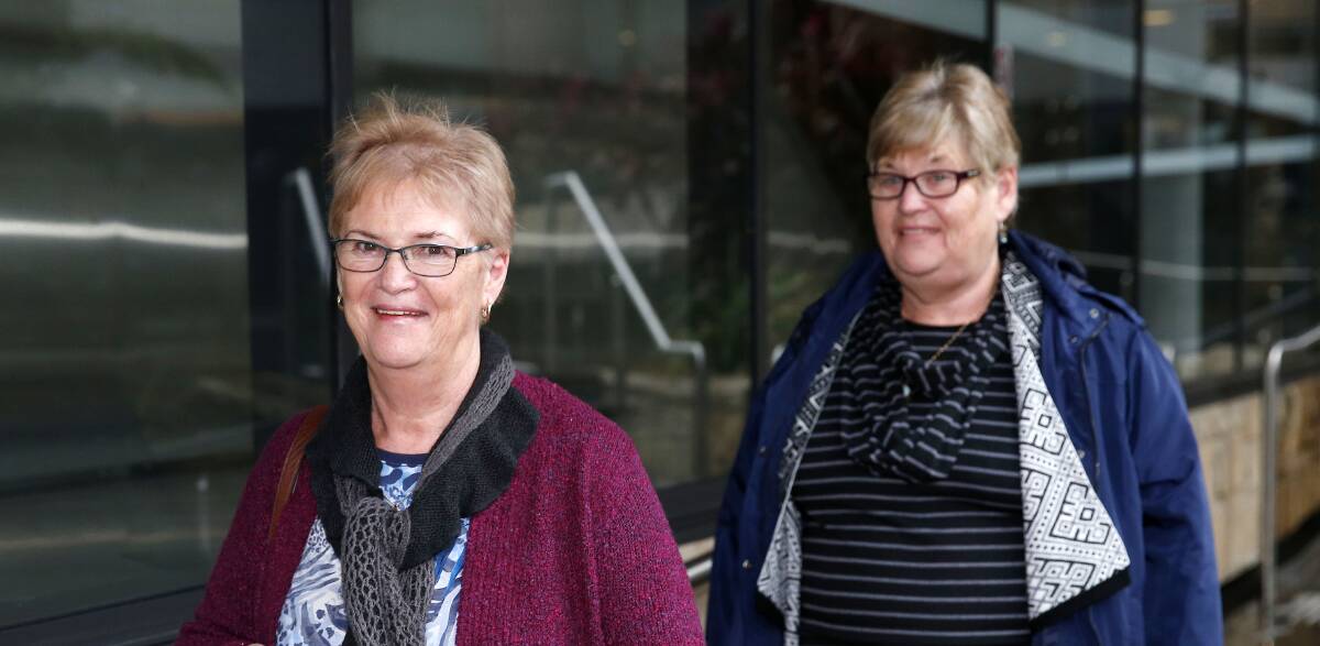 Pleased: Sisters Denise Laverie (left) and Anthea Halpin outside Newcastle Courthouse on Tuesday after a court was told Archbishop Philip Wilson should be jailed for concealing priest Jim Fletcher's crimes. Picture: Darren Pateman.