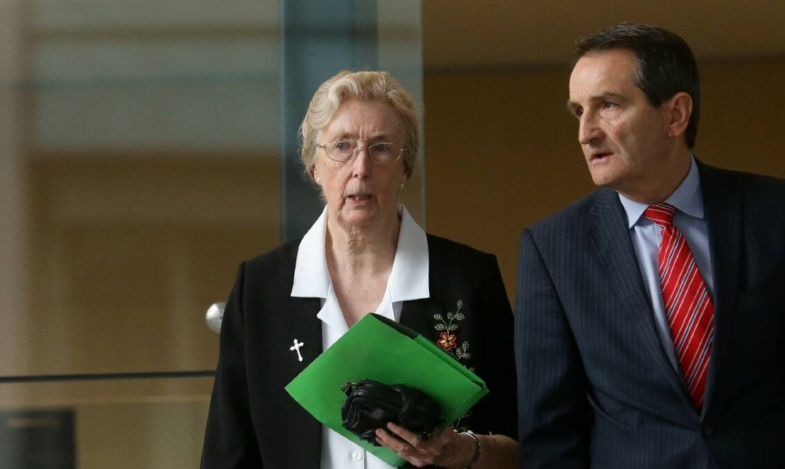 Hierarchy: Sister Evelyn Woodward and Catholic Church spokesman Francis Sullivan outside Newcastle Courthouse where the nun gave evidence of her knowledge of child sexual abuse. Picture: Jonathan Carroll.
 