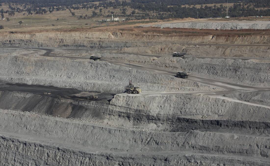 Exposed: A Hunter coal mine site showing exposed tracts of land required for open cut coal mining. A report says progressive rehabilitation targets should be higher, mandatory and enforceable.  