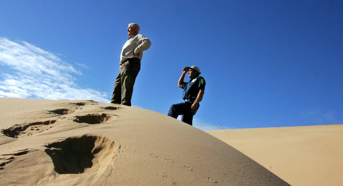 Rejected: Former Port Stephens mayor Bruce MacKenzie and son Robert at Stockton dunes. Their company's attempted appeal against an unlawful dump site decision against them was rejected on Friday. Picture: Kitty Hill. 