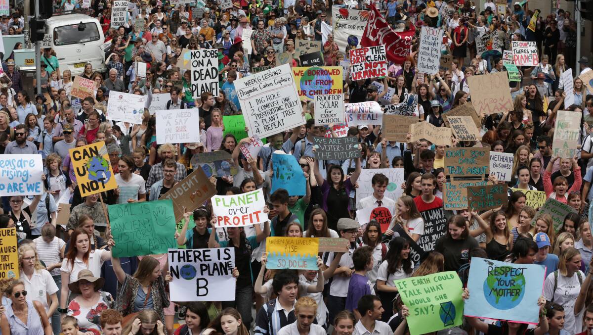 Action: Thousands march in Newcastle on March 15 in response to global calls for climate change action. Picture: Simone De Peak.