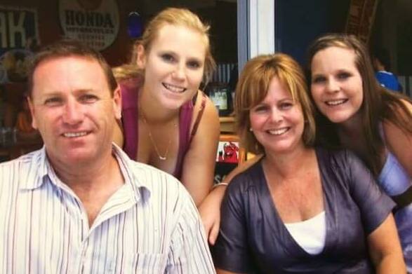 Tragic: Hunter paramedic Tony Jenkins, wife Sharon and daughters Kim and Cidney in happier times. Mr Jenkins' family has redoubled efforts to have an inquest into his suicide in April. 
