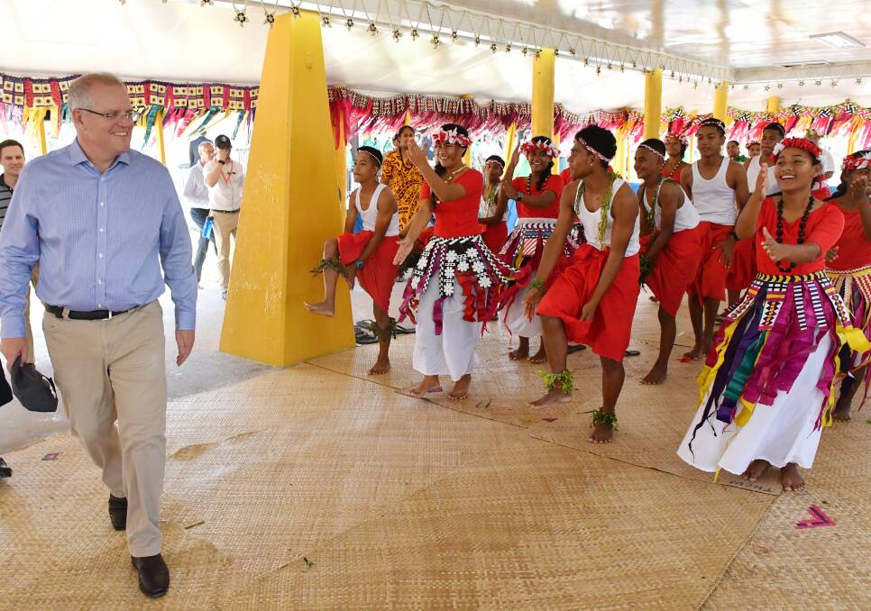 Farewell: Prime Minister Scott Morrison is farewelled at the end of the Pacific Islands Forum at Tuvalu. 