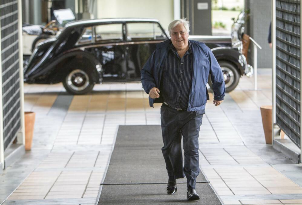 Spend: Clive Palmer walks into his Coolum resort on Queensland's Sunshine Coast. 