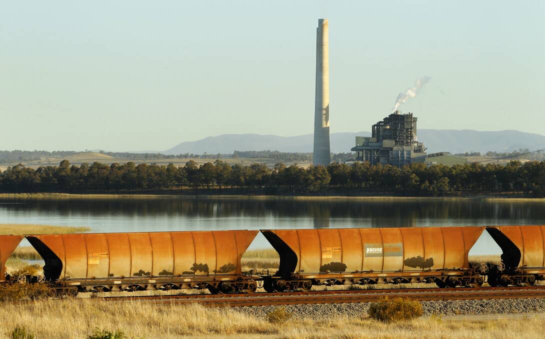Planning: A coal train near Liddell power station at Muswellbrook. A senior Hunter doctor says more testing and information about Hunter coronavirus cases is needed because of the concentration of workers at mines and power stations. Picture: Max Mason-Hubers.