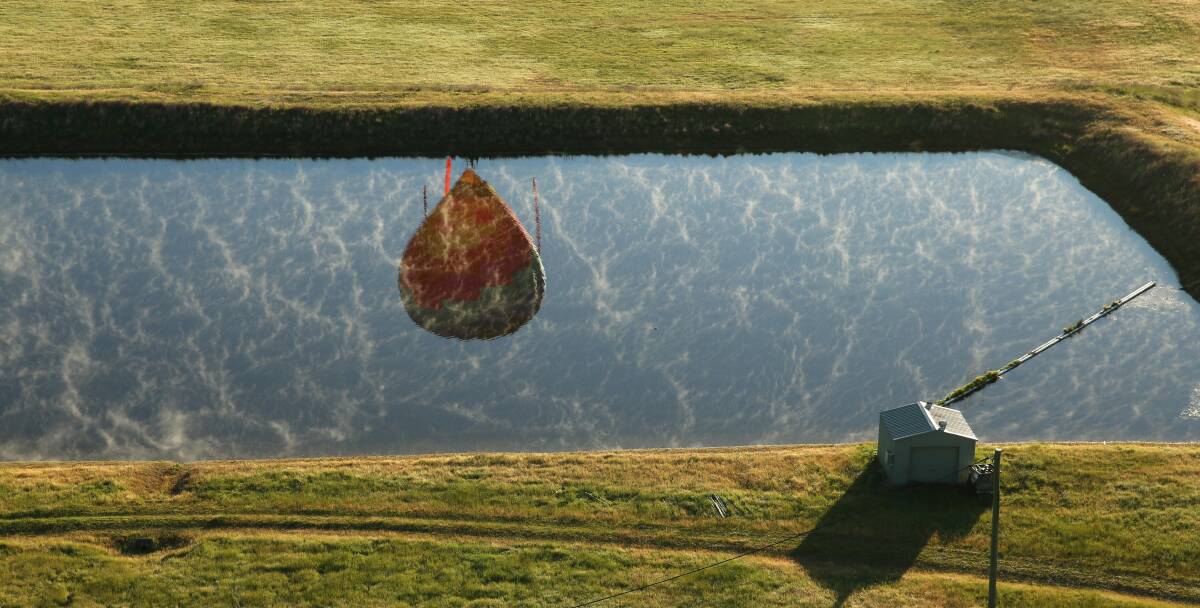 Balloon: A hot air balloon is reflected in a Hunter dam. An ATSB investigation has warned of the need for hot air balloon operators to carefully check weather conditions after a January, 2018 incident. 