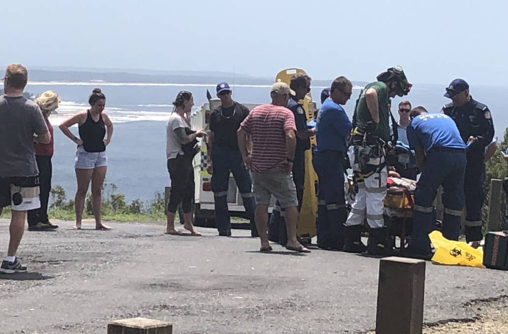 Treated: The man is treated at the scene at Crackneck Lookout. 