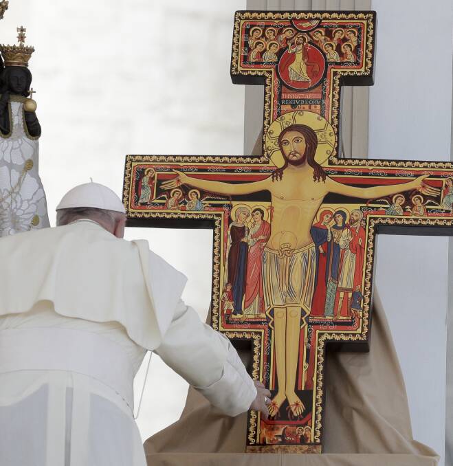 Symbol: Pope Francis and a crucifix.
