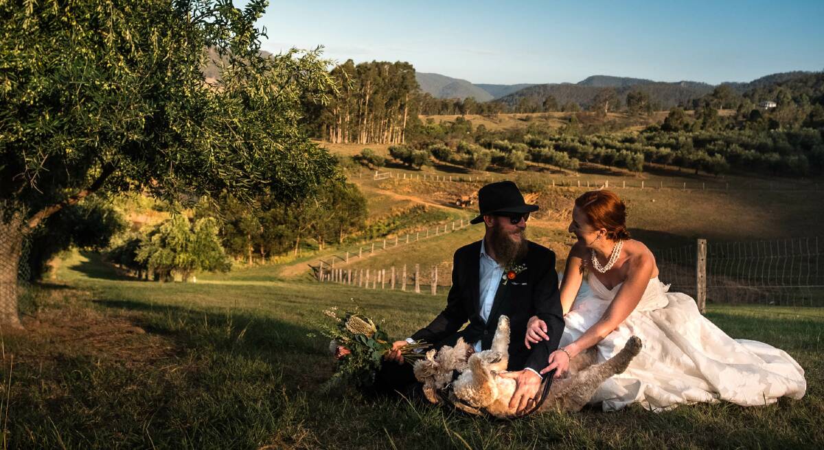 Happy: A couple after their wedding at Lonely Goat Olives guesthouse and wedding venue at Congewai before Federal and NSW Government orders this week restricting numbers at indoor gatherings in response to the coronavirus threat. Picture: Supplied.